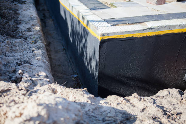 Professional Waterproofing technician working in Shelby, OH